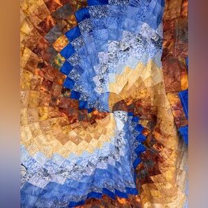 Circular patchwork quilt top 50 inches across blue, brown, tan